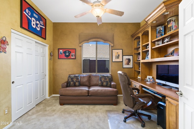 home office featuring ceiling fan and light colored carpet