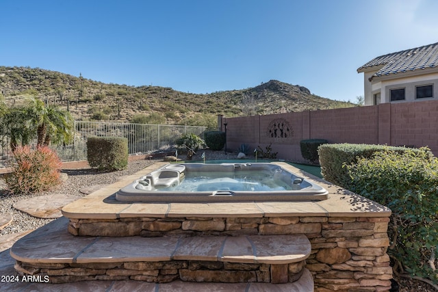 view of swimming pool featuring a mountain view