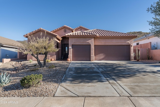 view of front of property with a garage