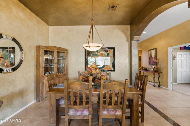 dining space featuring light tile patterned flooring