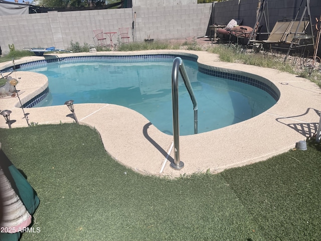 view of pool with fence and a fenced in pool