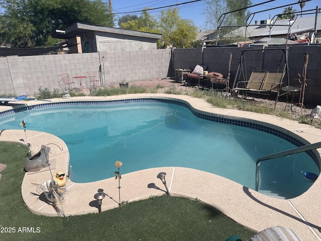 view of swimming pool featuring a fenced in pool and a fenced backyard