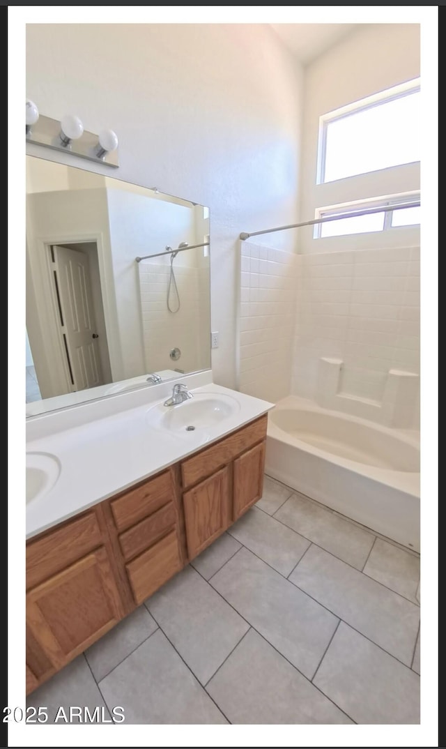 22951 W Loma Linda Blvd, Buckeye, AZ 85326 - bathroom with double vanity, washtub / shower combination, and tile patterned flooring