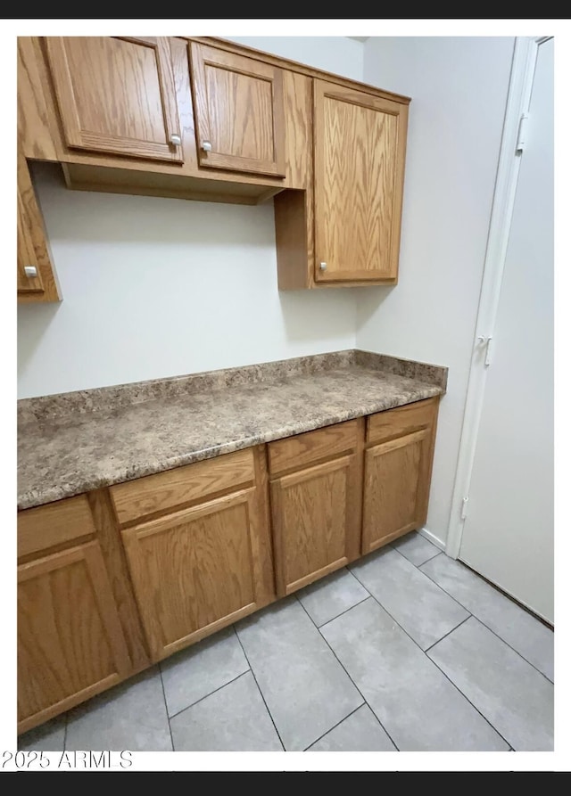 22951 W Loma Linda Blvd, Buckeye, AZ 85326 - kitchen with light tile patterned floors