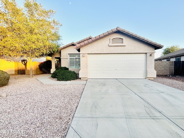 22951 W Loma Linda Blvd, Buckeye, AZ 85326 - single story home featuring stucco siding, a garage, concrete driveway, and a tiled roof
