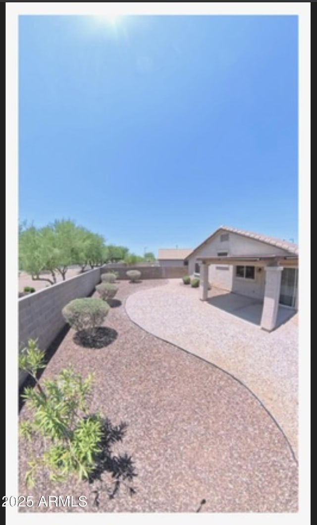 22951 W Loma Linda Blvd, Buckeye, AZ 85326 - fenced backyard with a patio area