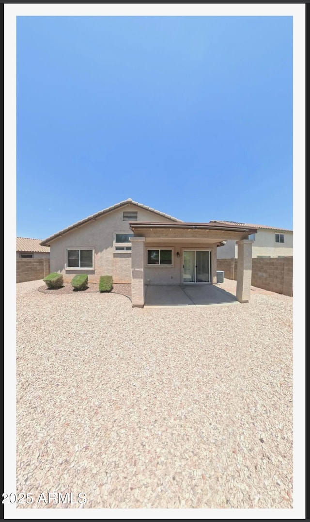 22951 W Loma Linda Blvd, Buckeye, AZ 85326 - back of house with a patio area, a fenced backyard, and stucco siding