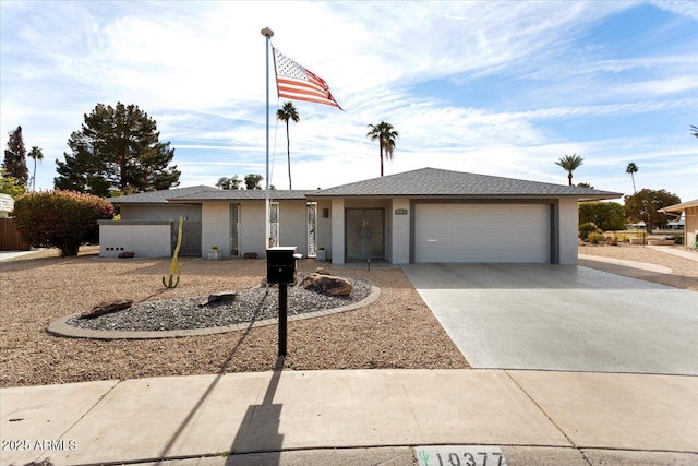 ranch-style home featuring a garage