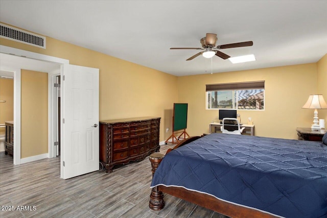 bedroom with ceiling fan and hardwood / wood-style floors