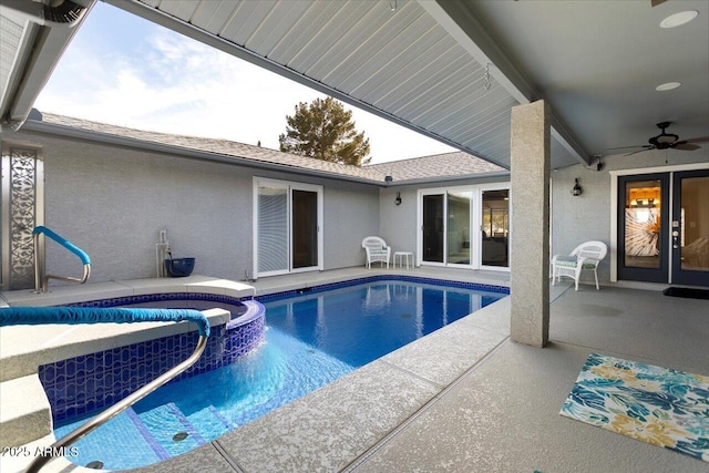 view of pool with a patio and ceiling fan