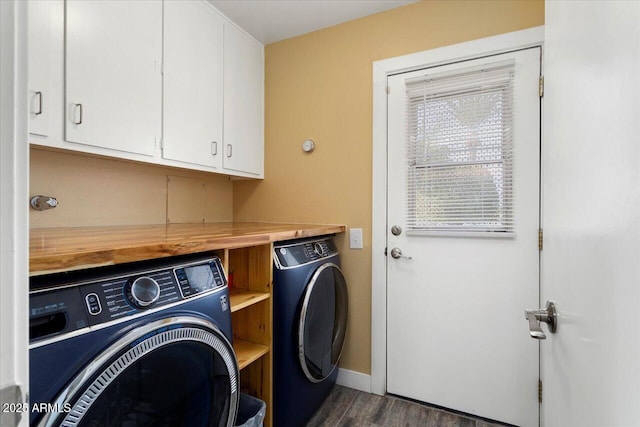 washroom with cabinets, dark hardwood / wood-style floors, and washer and dryer