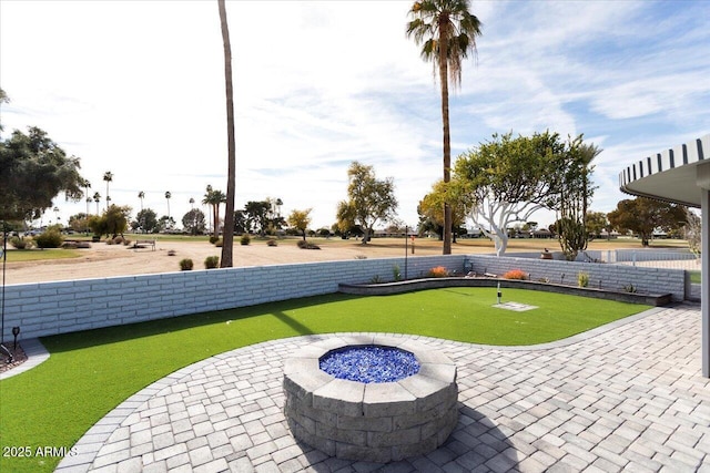 view of patio featuring an outdoor fire pit