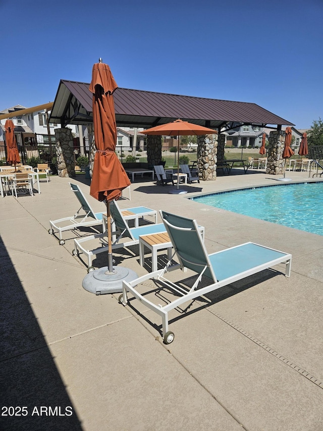 14224 W Hackamore Dr, Surprise, AZ 85387 - community pool with a patio area