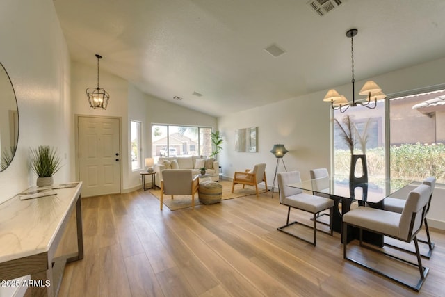 3940 E Heather Ct, Gilbert, AZ 85234 - dining area with a chandelier, lofted ceiling, and wood finished floors