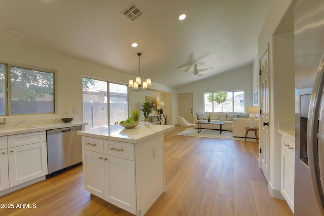 3940 E Heather Ct, Gilbert, AZ 85234 - kitchen featuring appliances with stainless steel finishes, lofted ceiling, light wood-type flooring, a ceiling fan, and white cabinetry