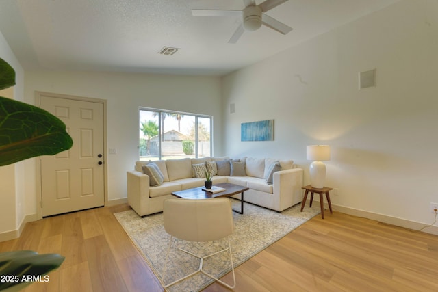3940 E Heather Ct, Gilbert, AZ 85234 - living room featuring light wood finished floors, a ceiling fan, and lofted ceiling