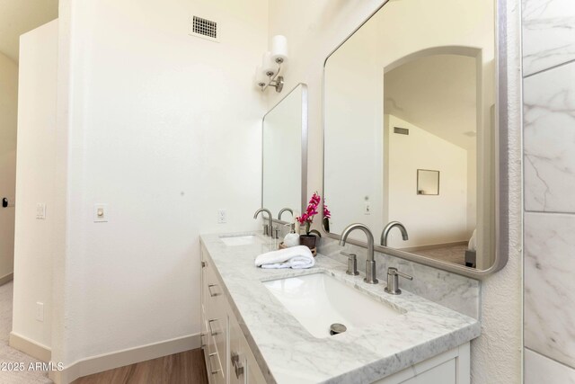 3940 E Heather Ct, Gilbert, AZ 85234 - full bath with double vanity and wood finished floors