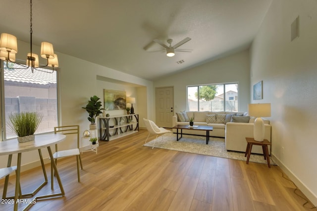 3940 E Heather Ct, Gilbert, AZ 85234 - living room with ceiling fan, vaulted ceiling, light wood-style flooring, and a chandelier