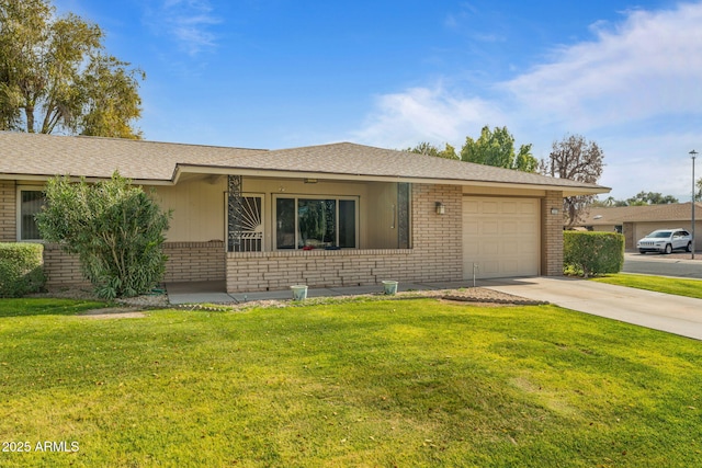 ranch-style house with a garage and a front lawn