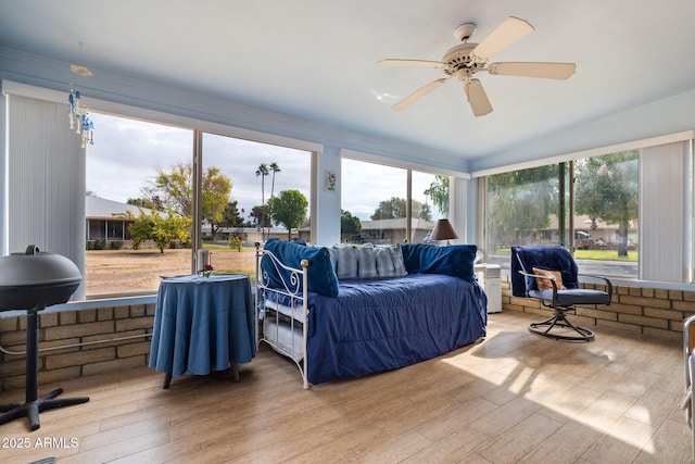 interior space with ceiling fan