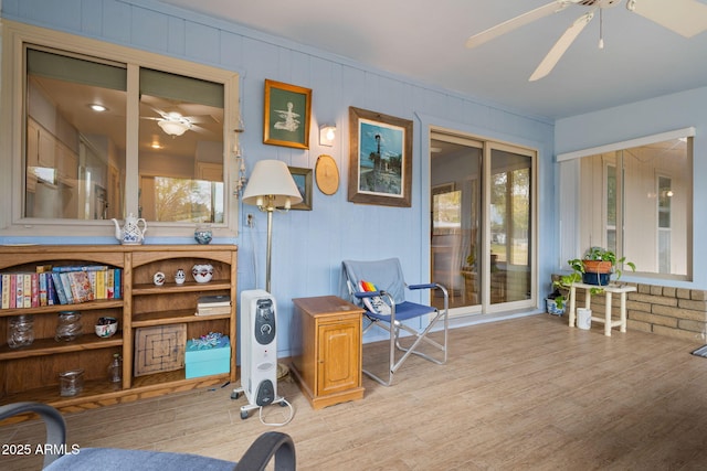 interior space featuring plenty of natural light, ceiling fan, and light wood-type flooring