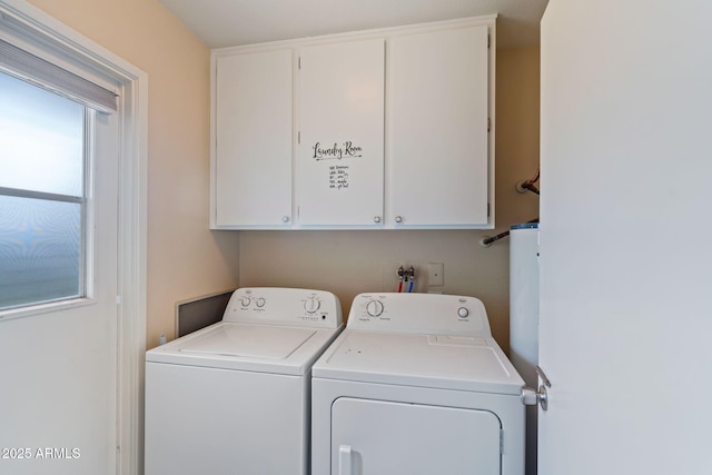 washroom with cabinets and independent washer and dryer