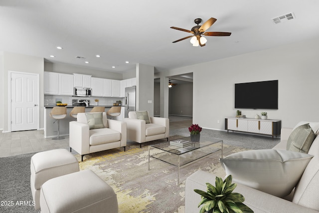29302 N 126th Ln, Peoria, AZ 85383 - living room featuring a ceiling fan, baseboards, and recessed lighting