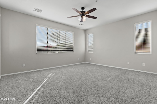 29302 N 126th Ln, Peoria, AZ 85383 - carpeted spare room with plenty of natural light, a ceiling fan, and baseboards