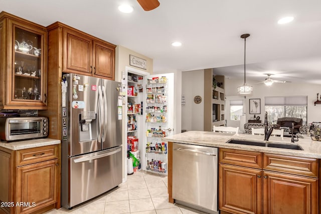 19822 N 108th Ave, Peoria, AZ 85373 - kitchen with appliances with stainless steel finishes, ceiling fan, a sink, brown cabinets, and recessed lighting