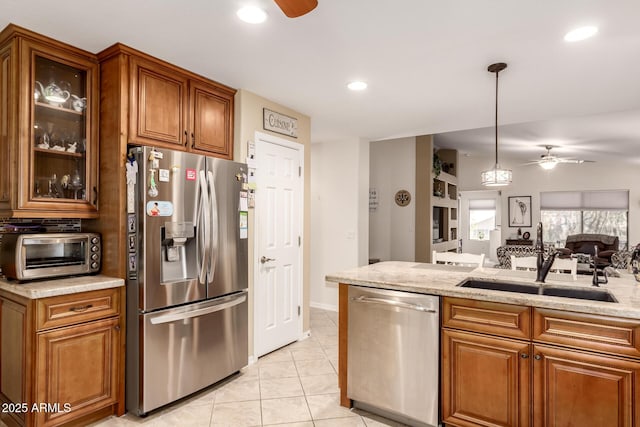 19822 N 108th Ave, Peoria, AZ 85373 - kitchen featuring stainless steel appliances, a ceiling fan, a sink, brown cabinets, and recessed lighting