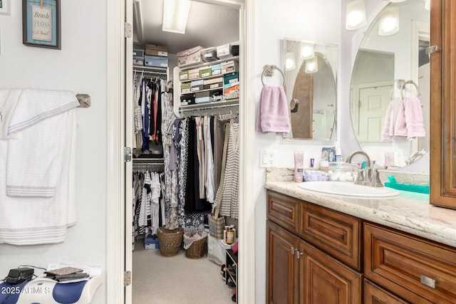 19822 N 108th Ave, Peoria, AZ 85373 - bathroom with vanity and a walk in closet