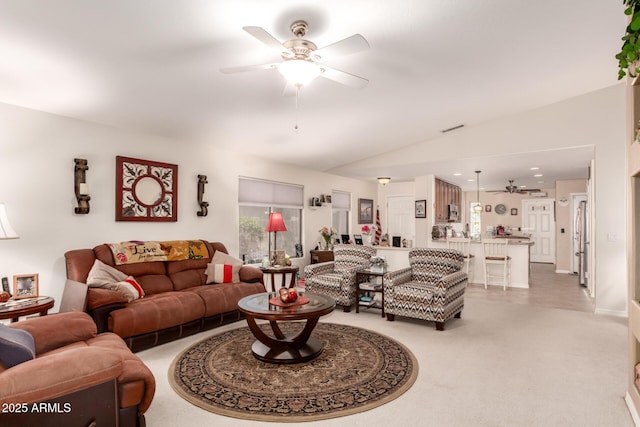 19822 N 108th Ave, Peoria, AZ 85373 - living room featuring a ceiling fan, vaulted ceiling, and light carpet