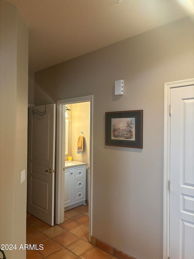 hallway with light tile patterned floors