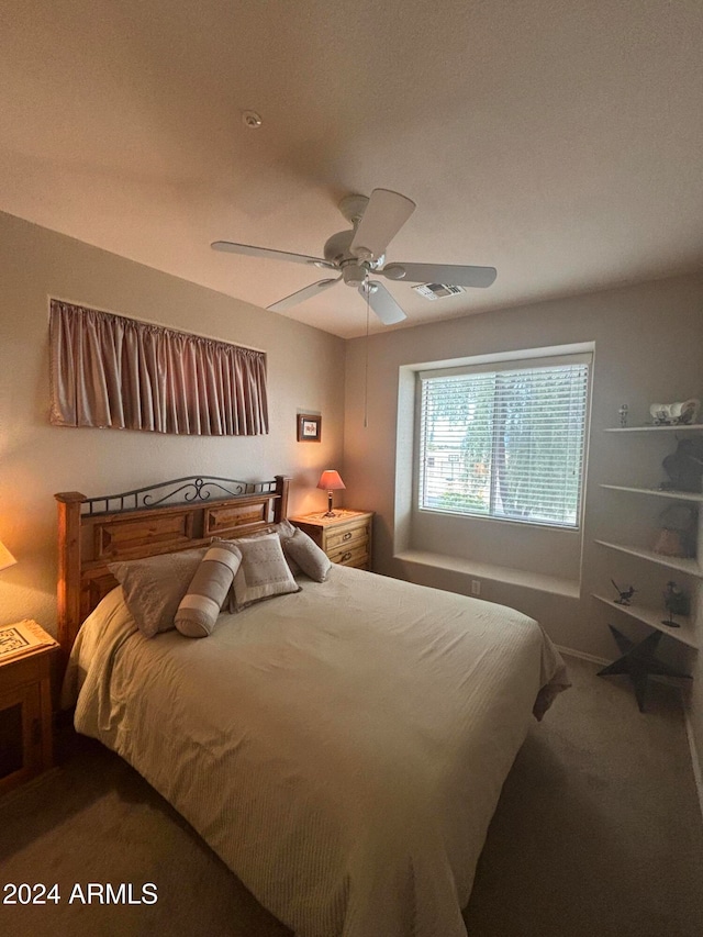 carpeted bedroom with ceiling fan