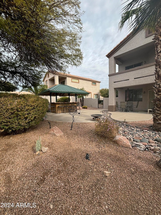 view of yard with a gazebo and a patio