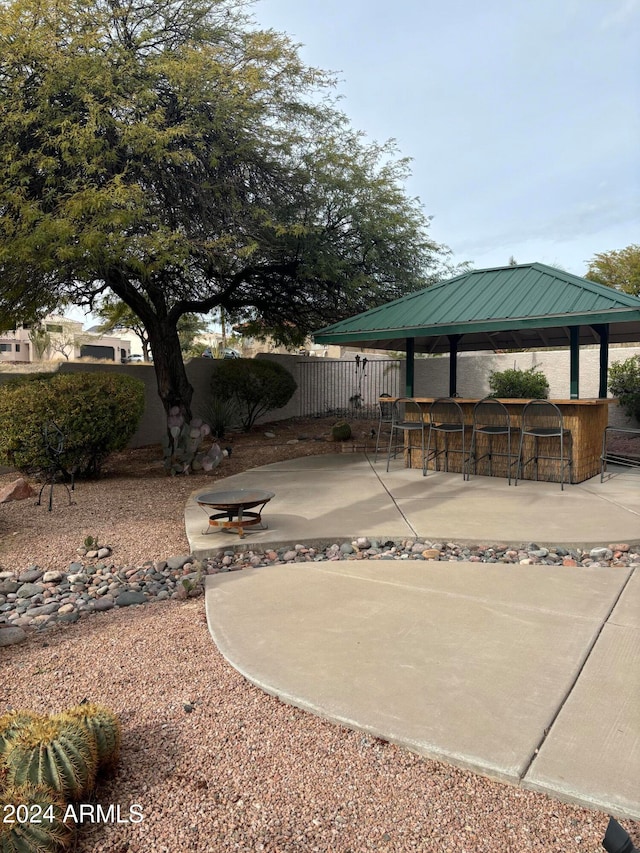 view of patio with a gazebo and a bar