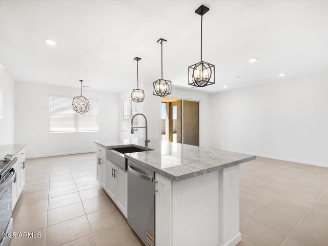 kitchen featuring stainless steel dishwasher, white cabinetry, an inviting chandelier, and a sink