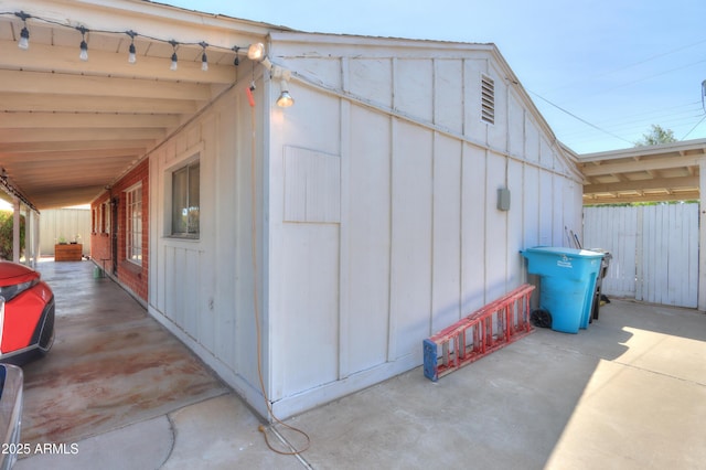 view of outbuilding with fence