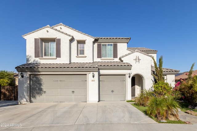 mediterranean / spanish-style home featuring a garage