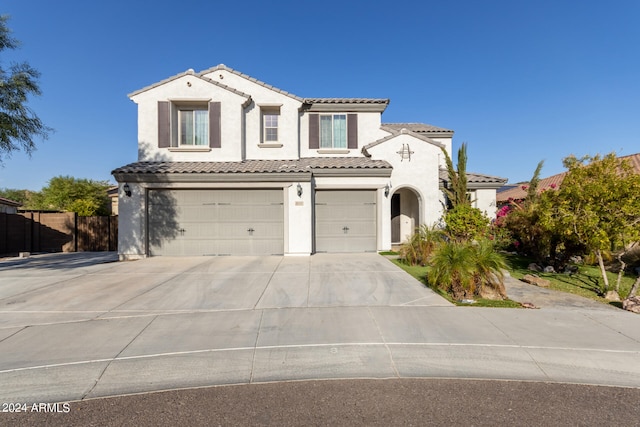 mediterranean / spanish-style house featuring a garage