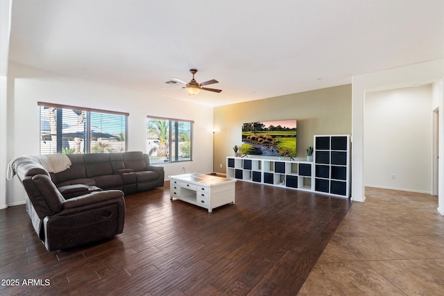 living room with dark hardwood / wood-style floors and ceiling fan