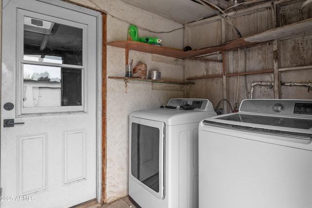 laundry room with washing machine and dryer and laundry area