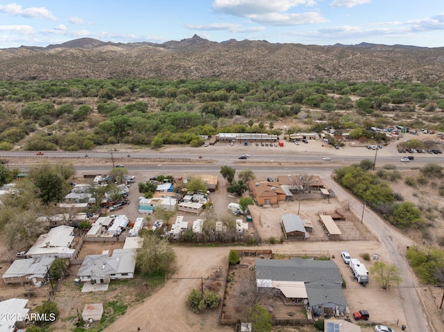 birds eye view of property with a mountain view