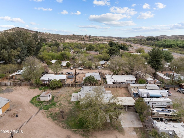 birds eye view of property featuring a mountain view