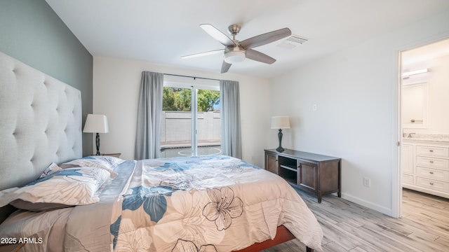 bedroom with light wood-type flooring, visible vents, connected bathroom, baseboards, and ceiling fan