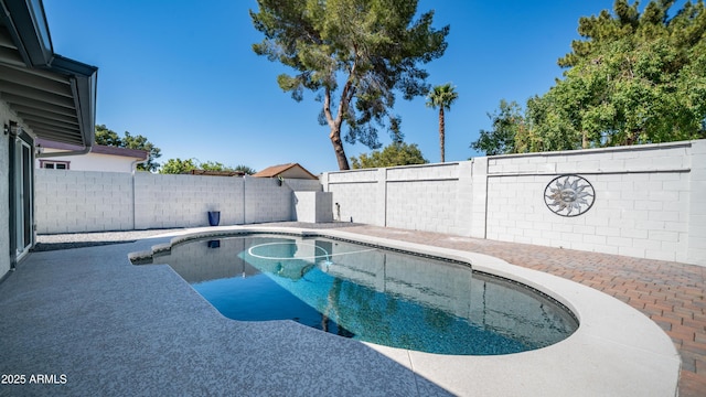 view of swimming pool with a patio, a fenced backyard, and a fenced in pool