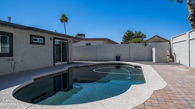 view of swimming pool with a fenced in pool, a patio, and a fenced backyard