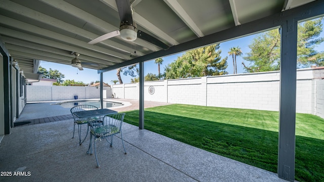 view of patio with a fenced backyard and ceiling fan