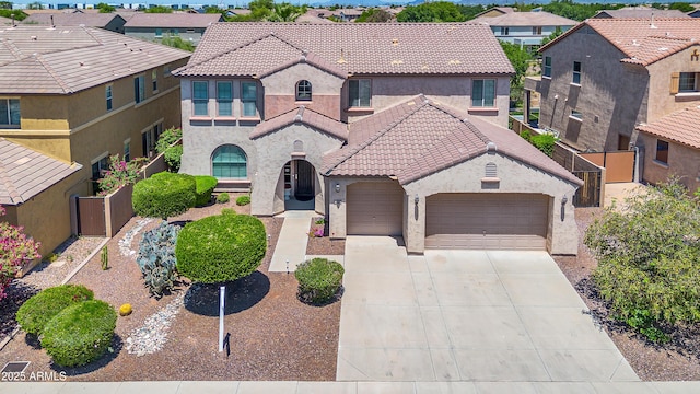 mediterranean / spanish-style home featuring a garage