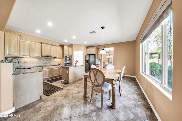 tiled dining room with sink